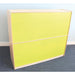 A two-drawer chest or cabinet with bright yellow-green front panels and a light natural wood frame, shown standing on a gray carpet against a pale blue wall.